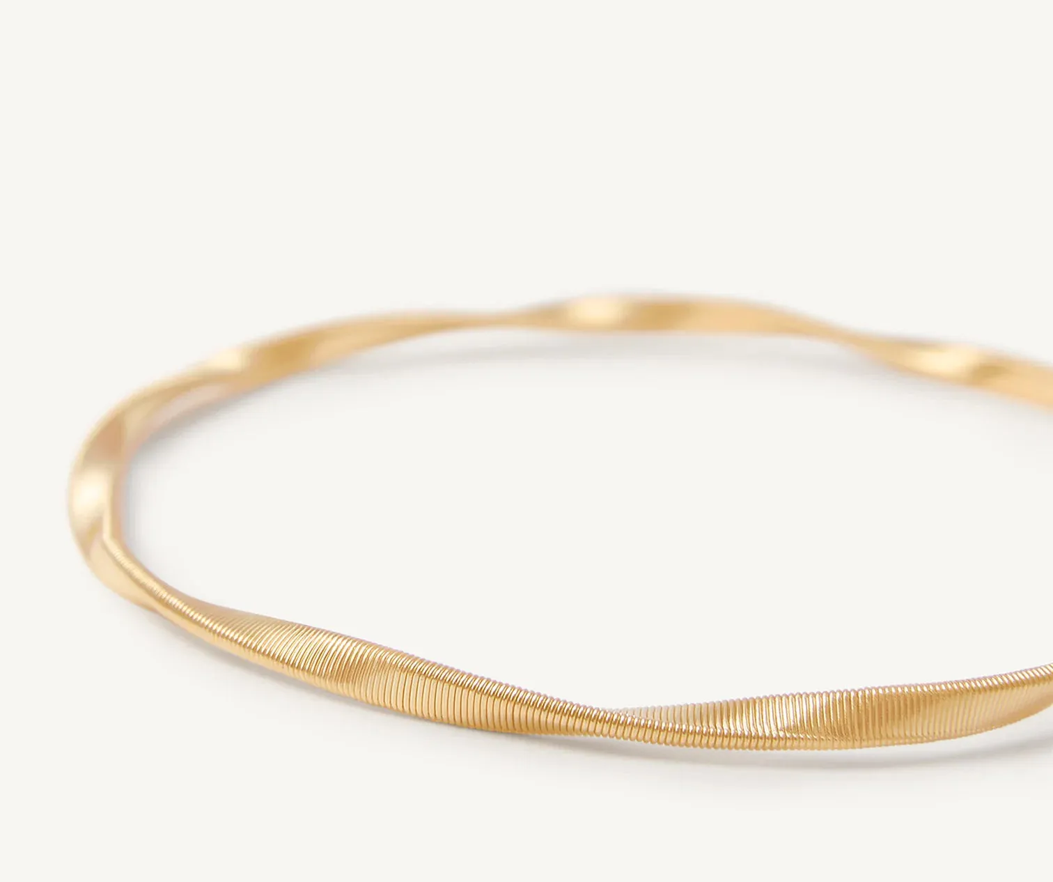 18K YELLOW GOLD TWISTED COIL BRACELET FROM THE MARRAKECH COLLECTION